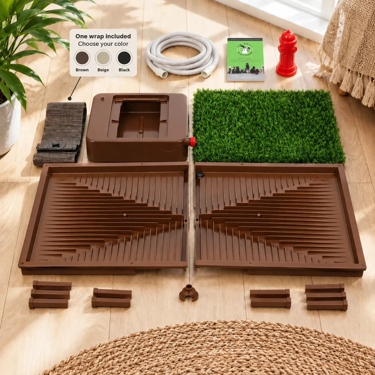 Complete Porch Potty CORE base components, wrap colors, drainage hose, catch basin, grass, and training guide arranged in a bright home